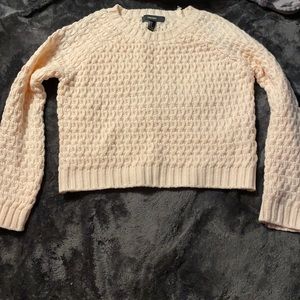 Pink knitted sweater.